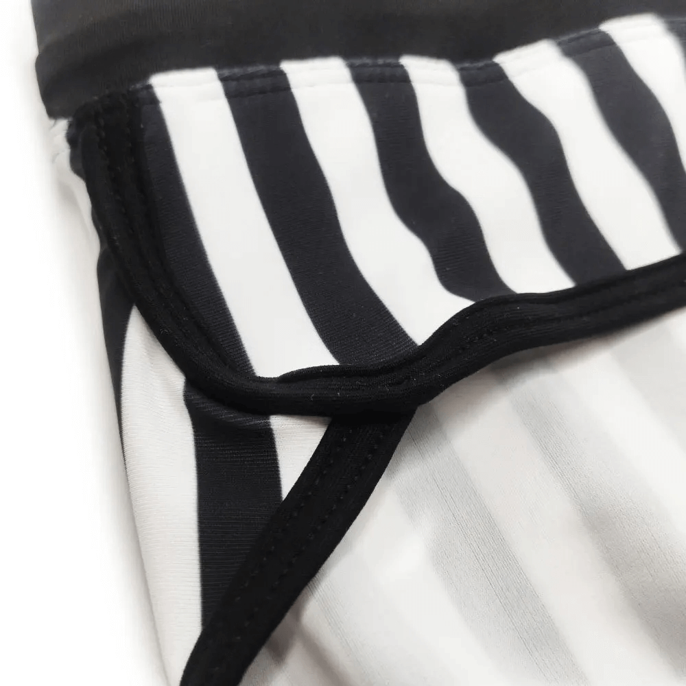 Close-up view of zebra print quick-dry swim briefs for men, showcasing bold black and white stripes. Product code: SF2181.
